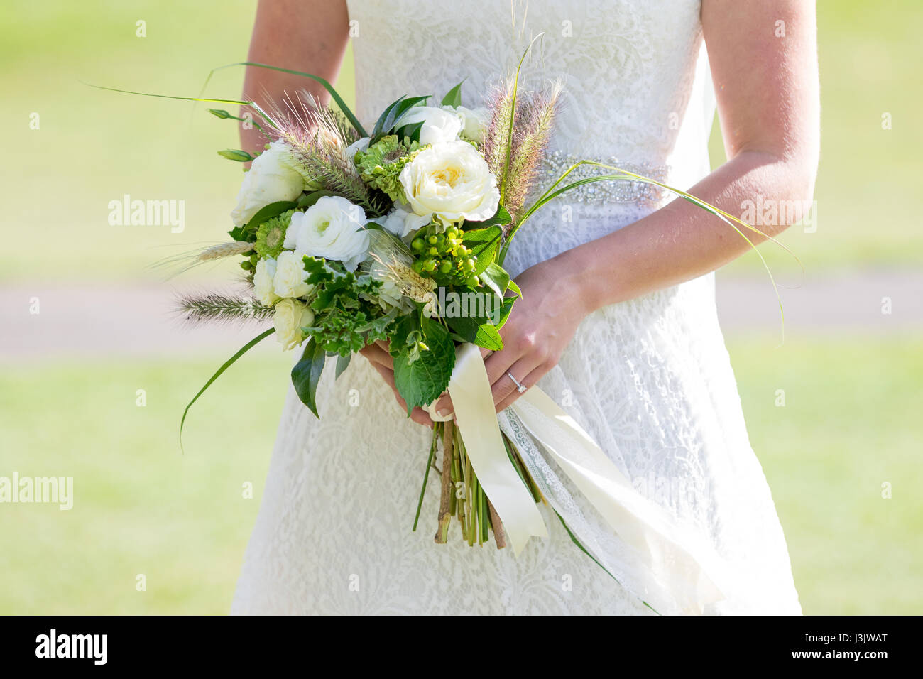 Bride Holding Wedding Bouquet Stock Photo - Alamy