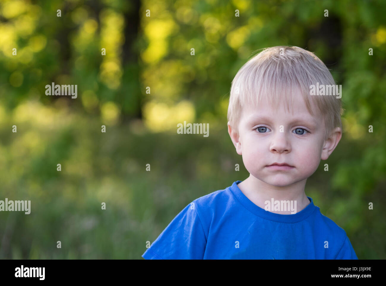 Portrait of a little boy outdoors Stock Photo - Alamy