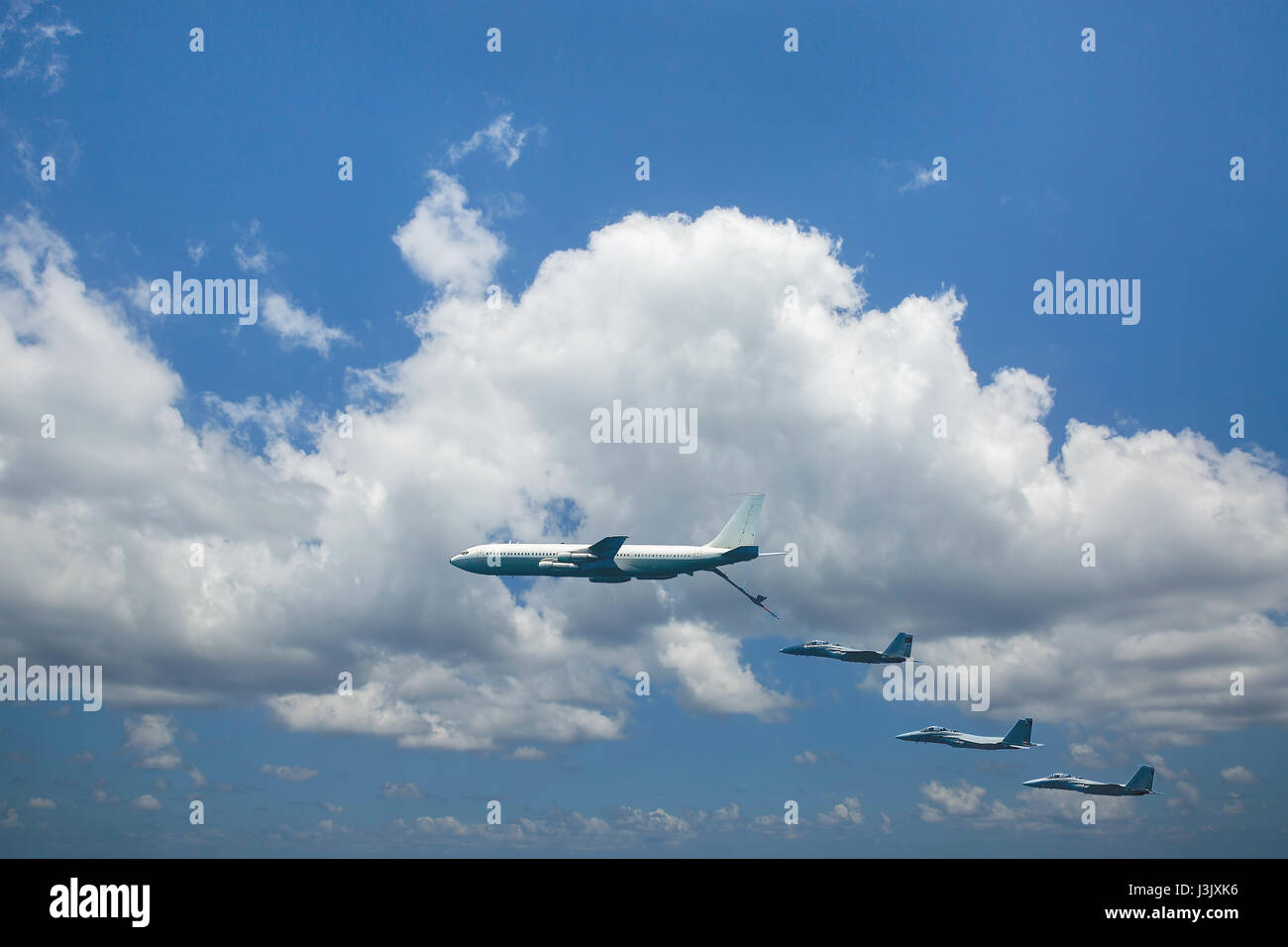Refueling military aircraft in the sky of Israel against the background of clouds Stock Photo