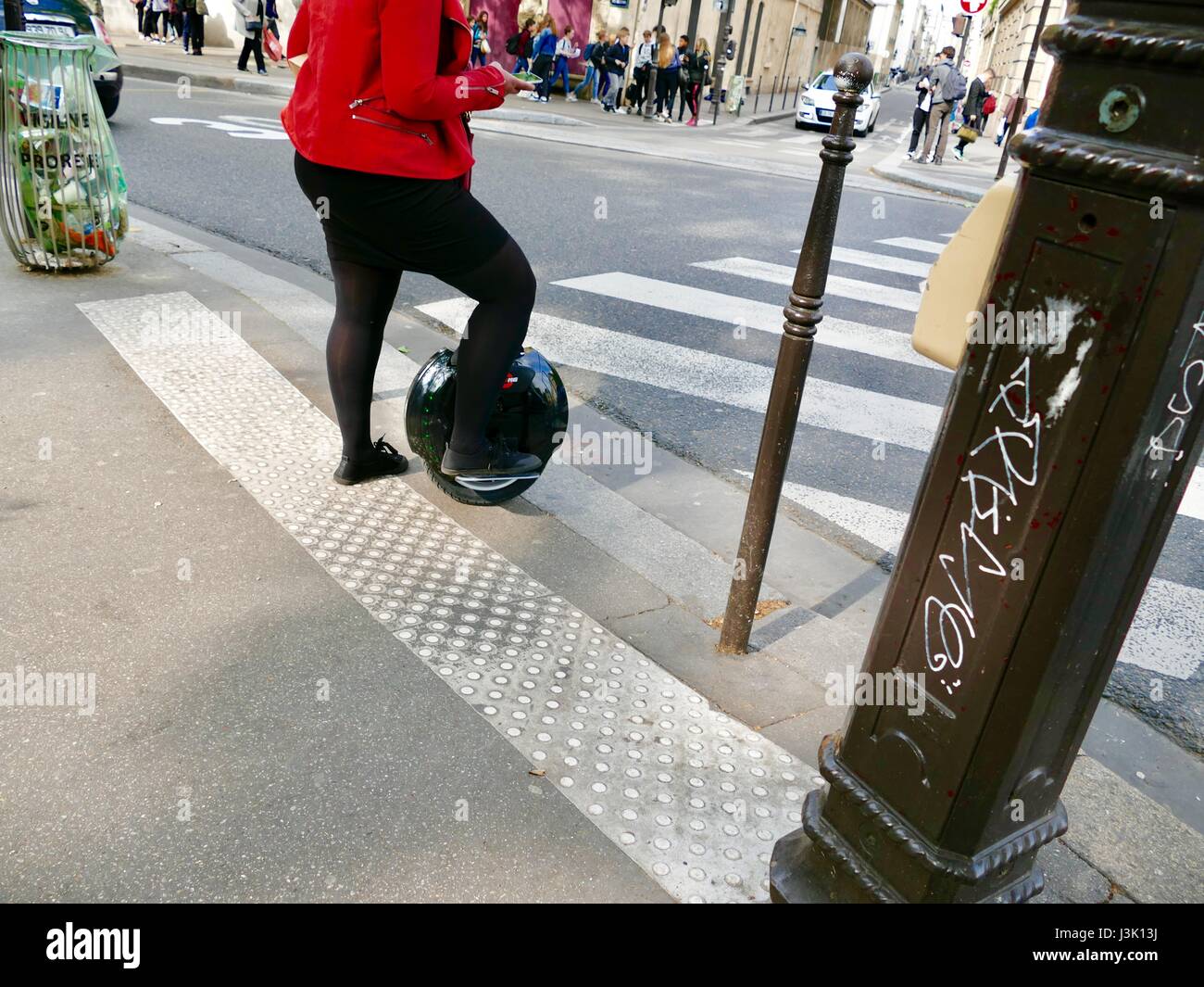 Woman in paris with electric unicycle hires stock photography and