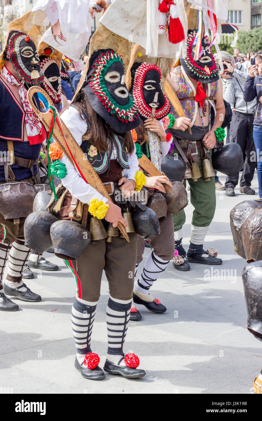 Varna Bulgaria - April 26.2017: Unidentified man in traditional Kukeri costume are seen at the Festival of the Masquerade Games Surva in Varna Bulgari Stock Photo