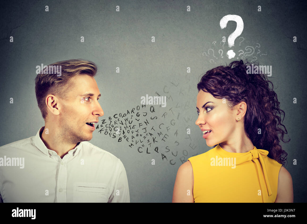 Man talking to an attractive woman with question mark Stock Photo