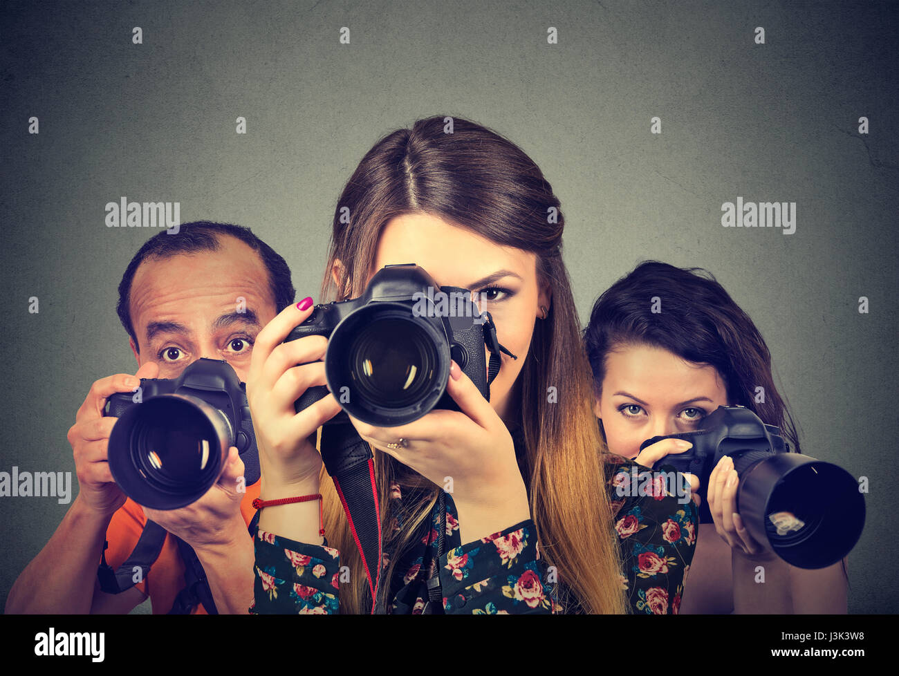 Group of photographers with professional cameras Stock Photo Alamy