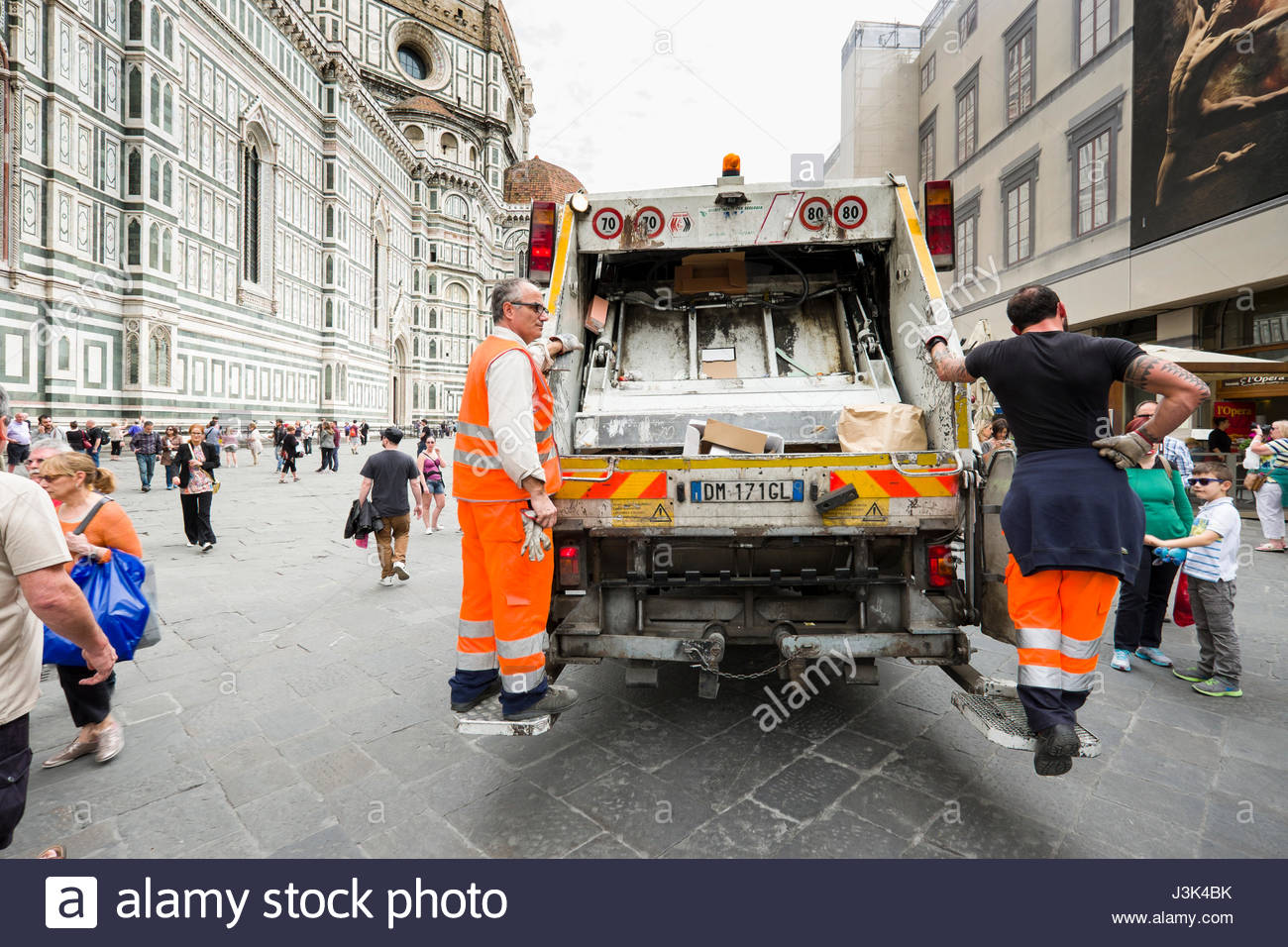 riding garbage truck