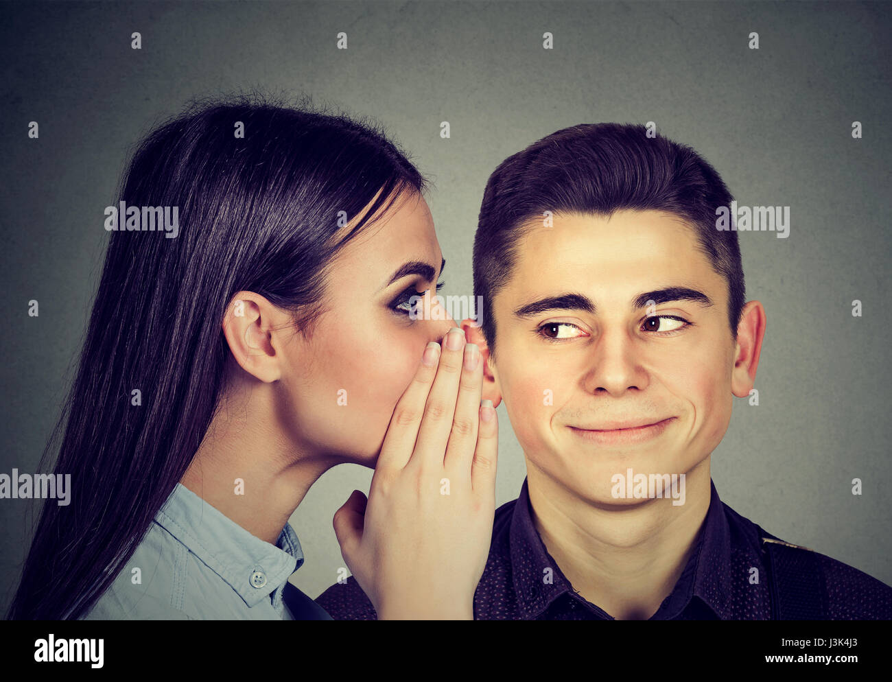 Latest rumors. Curious man listening gossip in the ear Stock Photo