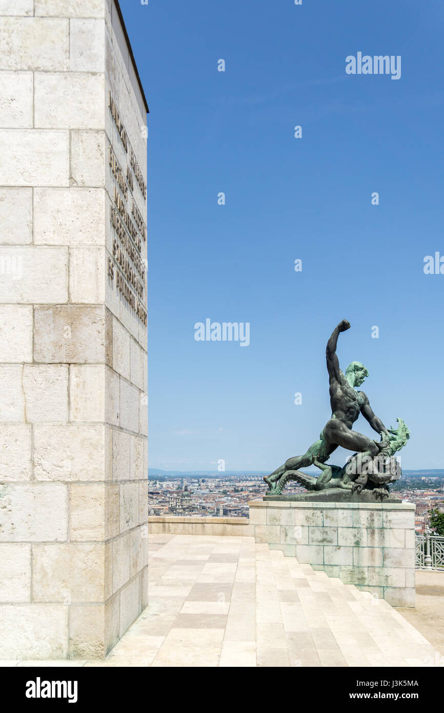 One of the two smaller statues on Gellert Hill, that sit at the foot of the Liberty Statue, in Budapest, Hungary, this one of a man slaying a dragon. Stock Photo