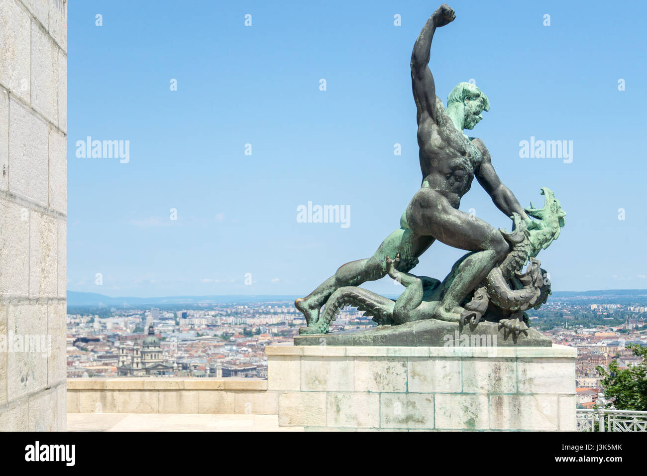 One of the two smaller statues on Gellert Hill, that sit at the foot of the Liberty Statue, in Budapest, Hungary, this one of a man slaying a dragon,  Stock Photo