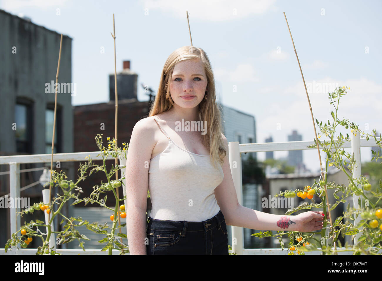 Portrait of a beautiful young woman in a garden Stock Photo - Alamy