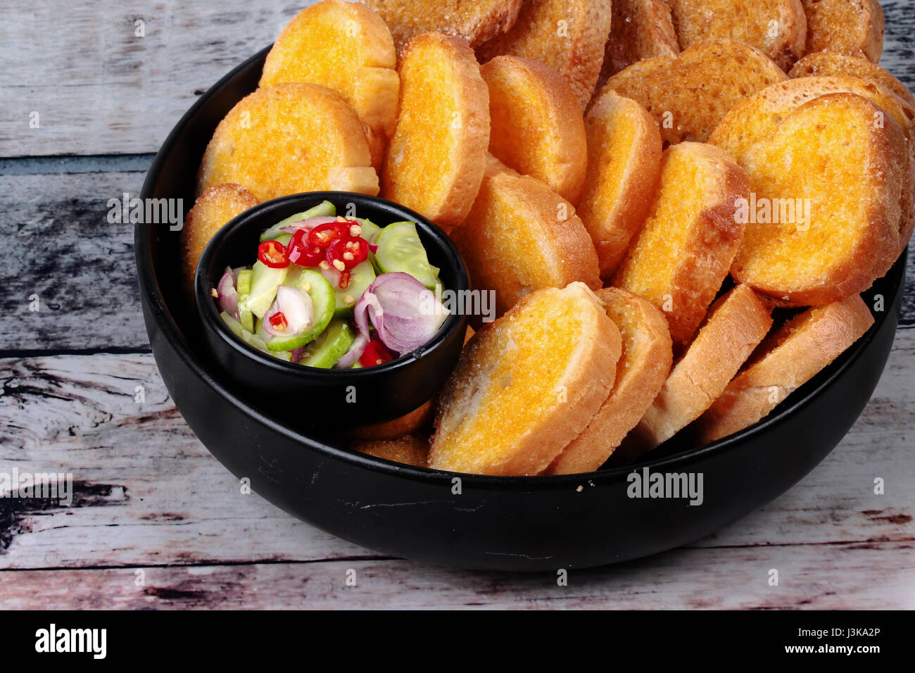 Thai style bread , Crispy butter toast served ,crispy margarine toast ,with spicy sour sauce