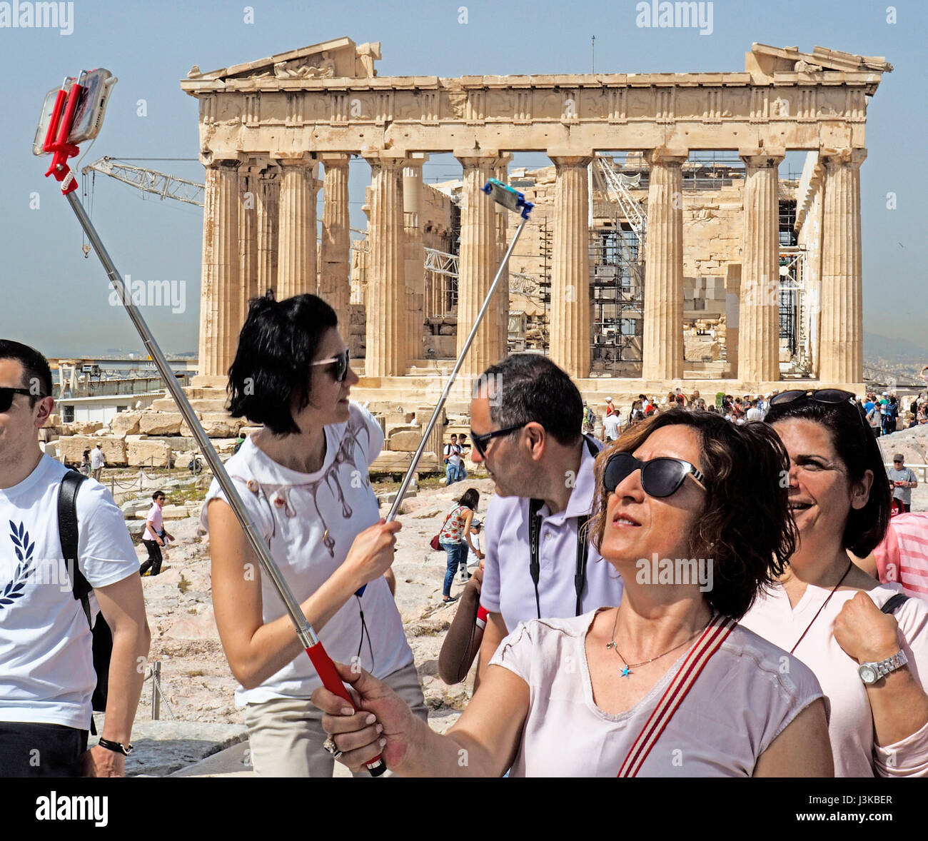 Tourists doing selfies at the Parthenon in Athens. Stock Photo