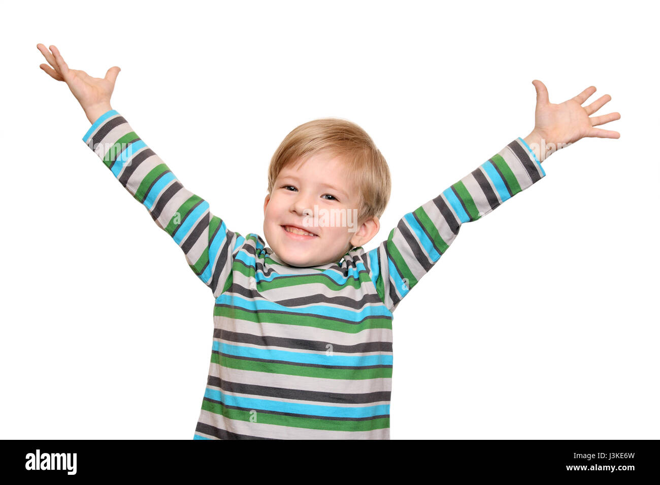 Joyful kid with arms outstretched welcomes, isolated on white background Stock Photo