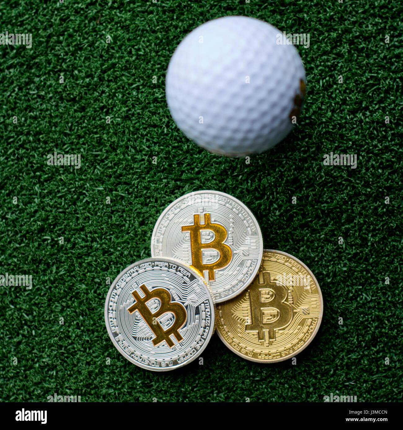 Digital currency physical bitcoin coins in golf club Stock Photo - Alamy
