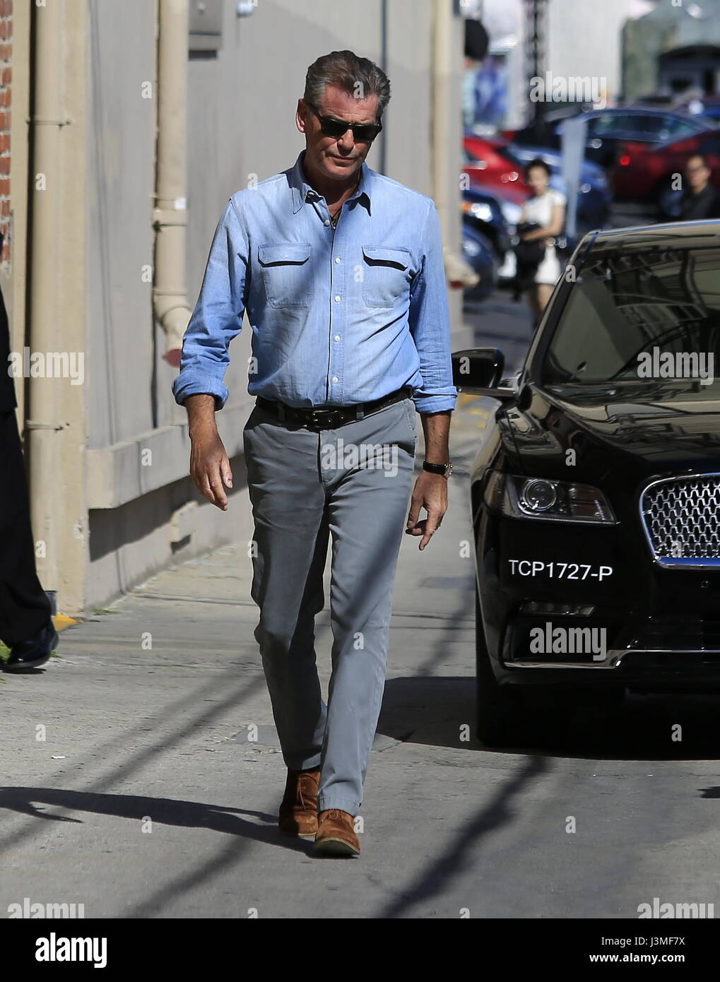Pierce Brosnan arrives at 'Jimmy Kimmel Live!' studios and stops to sign autographs Featuring
