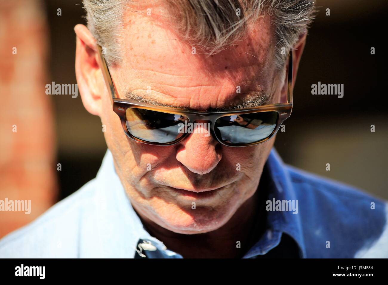 Pierce Brosnan arrives at 'Jimmy Kimmel Live!' studios and stops to
