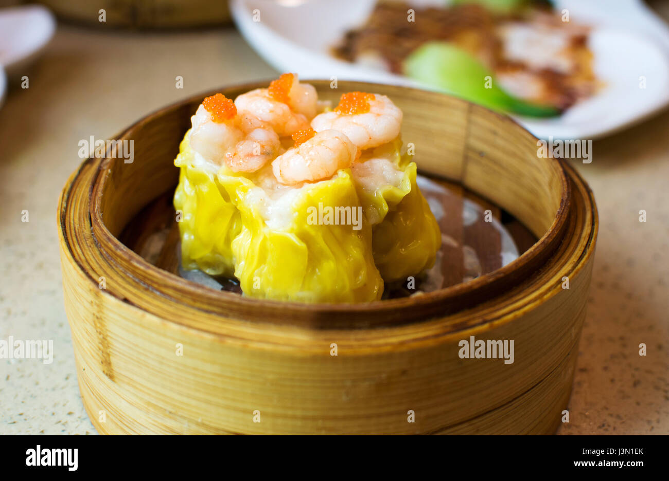 Chinese dimsum shrimp shao mai on bamboo steamer Stock Photo