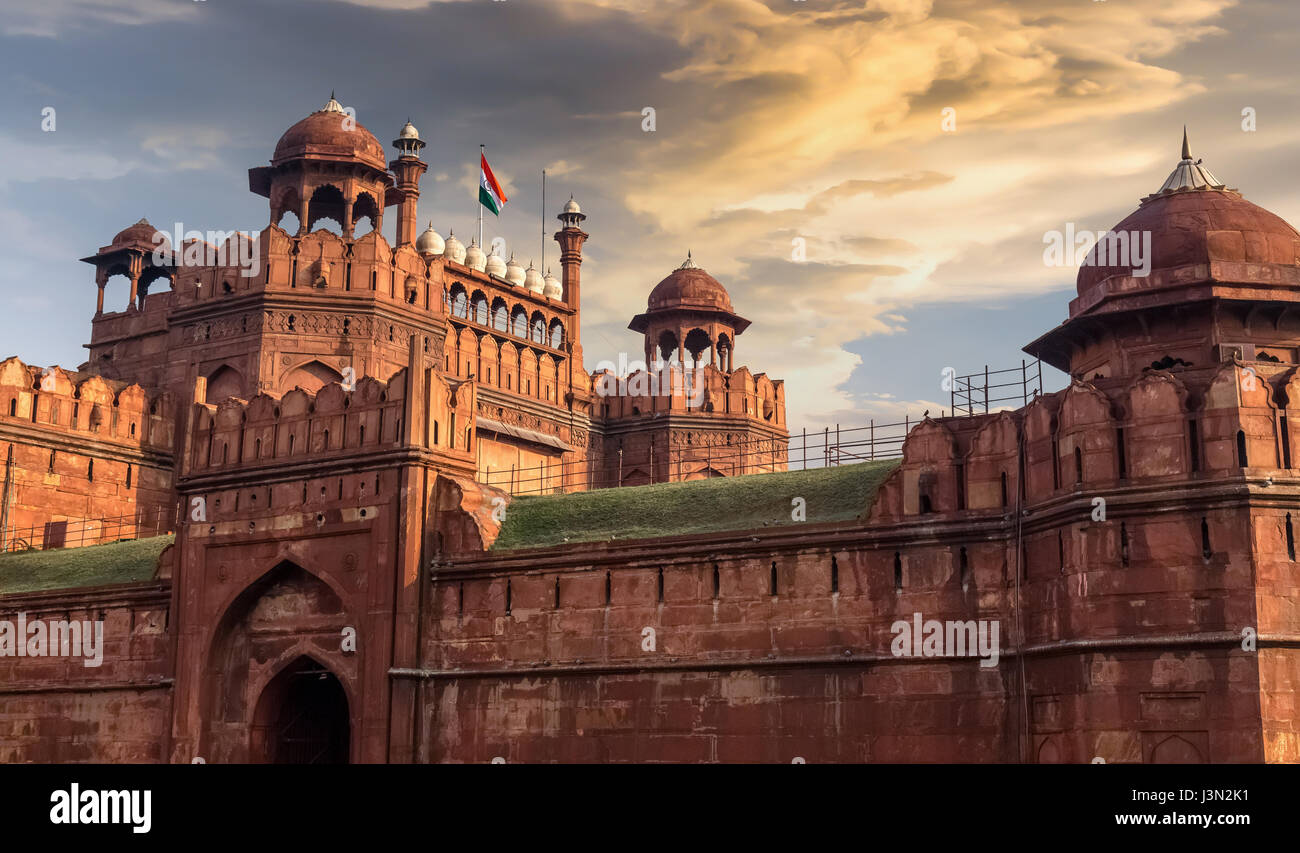 Red Fort Delhi at sunset with moody sky. Red Fort is a red sandstone fort city designated as a UNESCO World heritage site. Stock Photo