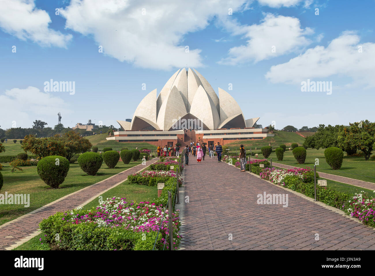 Lotus temple Delhi is the Bahai house of worship and a notable city landmark for its unique architectural design replicating a lotus flower. Stock Photo