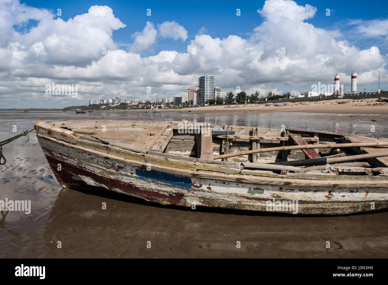 A fishing boat at low tide in the Mozambique capital city of Maputo Stock Photo