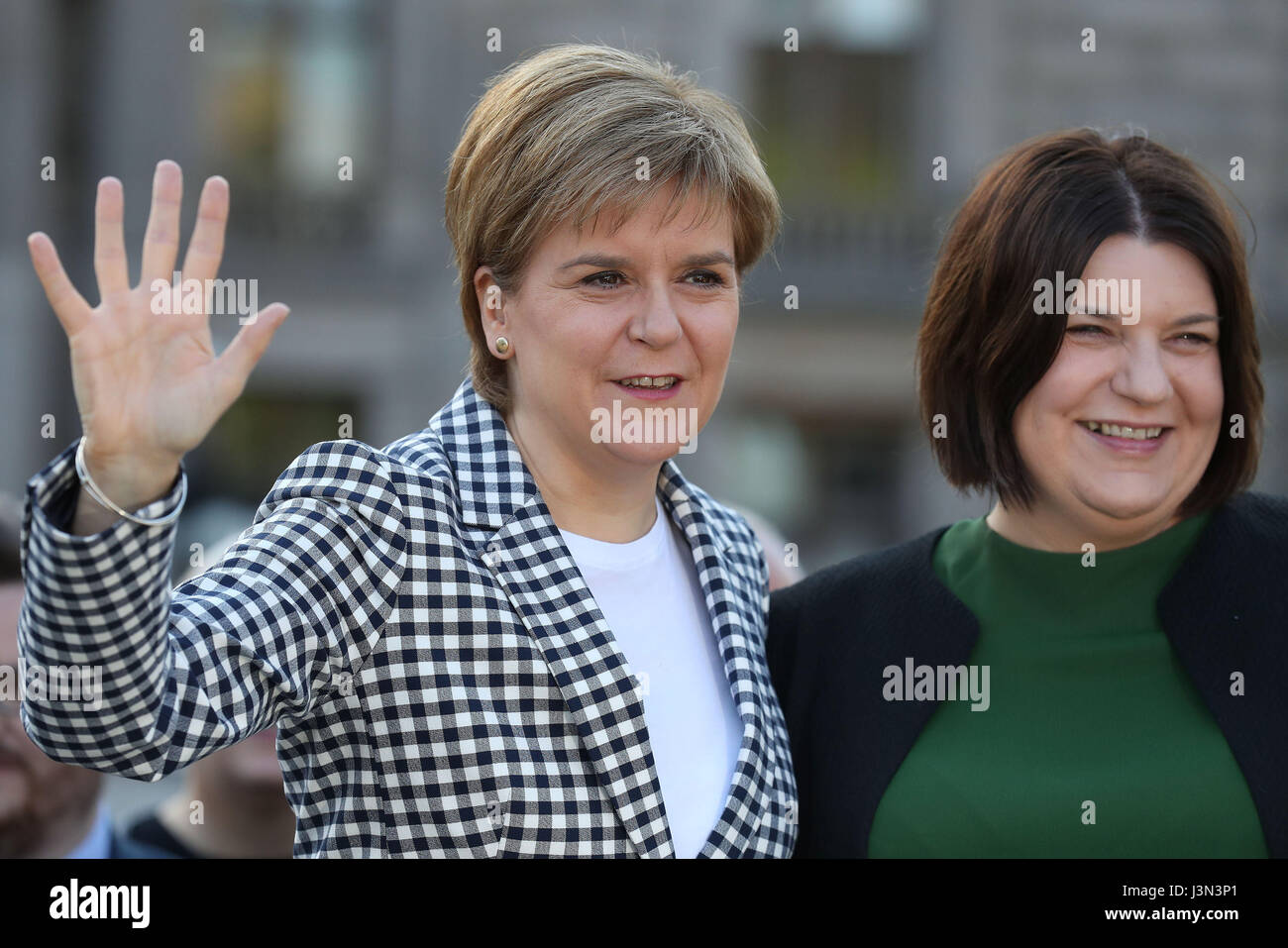 First Minister Nicola Sturgeon (left) with Susan Aitken, the new leader of SNP group on Glasgow City Council at a photo call with the SNP's new council group in Glasgow's George Square to mark the party's victory in the Scottish local elections. Stock Photo