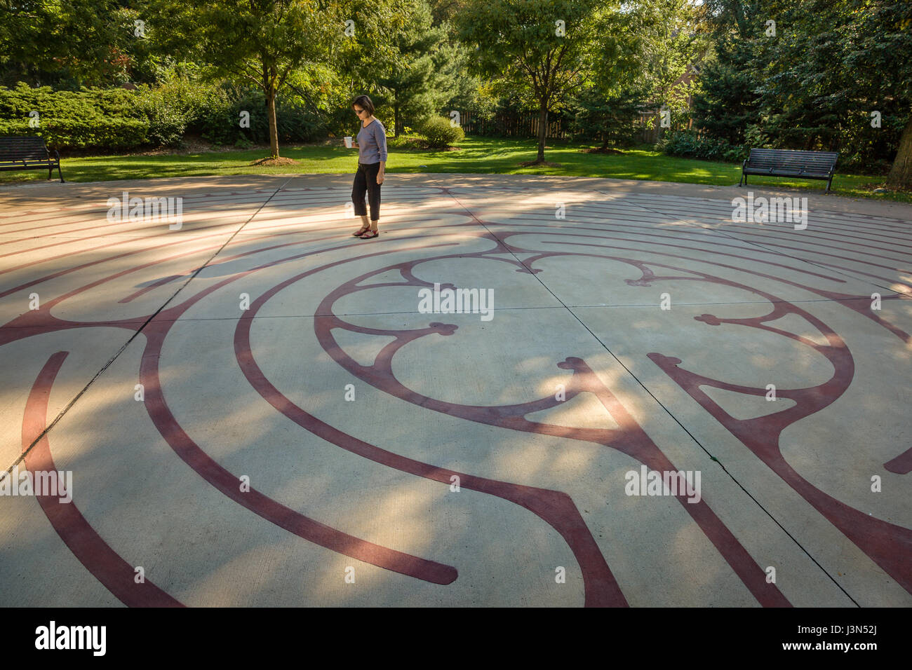 One woman walking a labyrinth in Burlington Ontario, Central Park Stock Photo