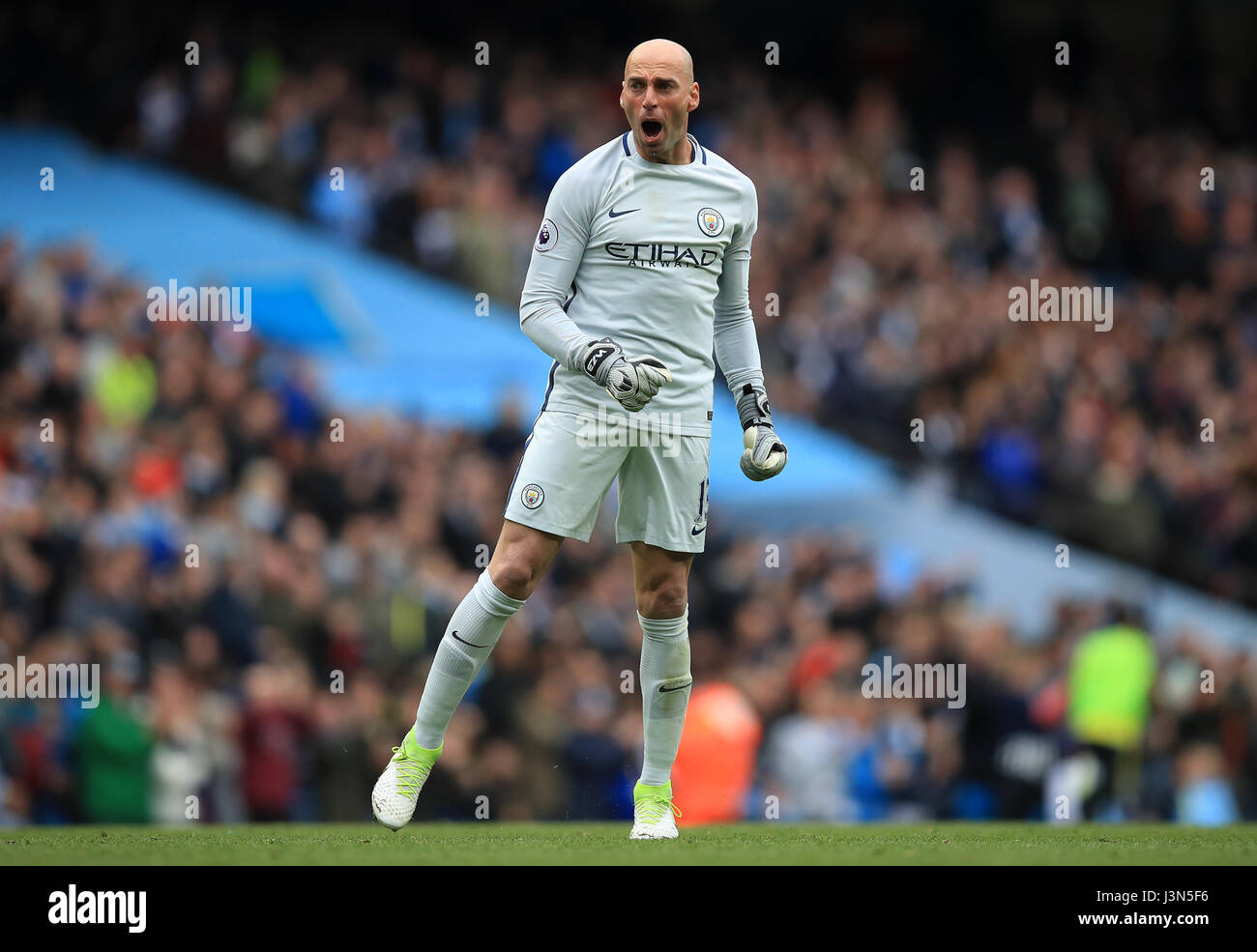 Manchester City goalkeeper Willy Caballero celebrates his side's third goal of the game scored by Kevin De Bruyne during the Premier League match at the Etihad Stadium, Manchester. Stock Photo