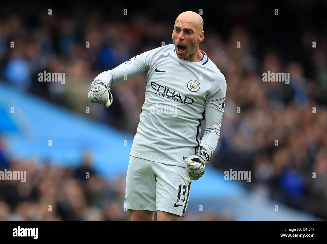 Manchester City goalkeeper Willy Caballero celebrates his side's third goal of the game scored by Kevin De Bruyne during the Premier League match at the Etihad Stadium, Manchester. Stock Photo