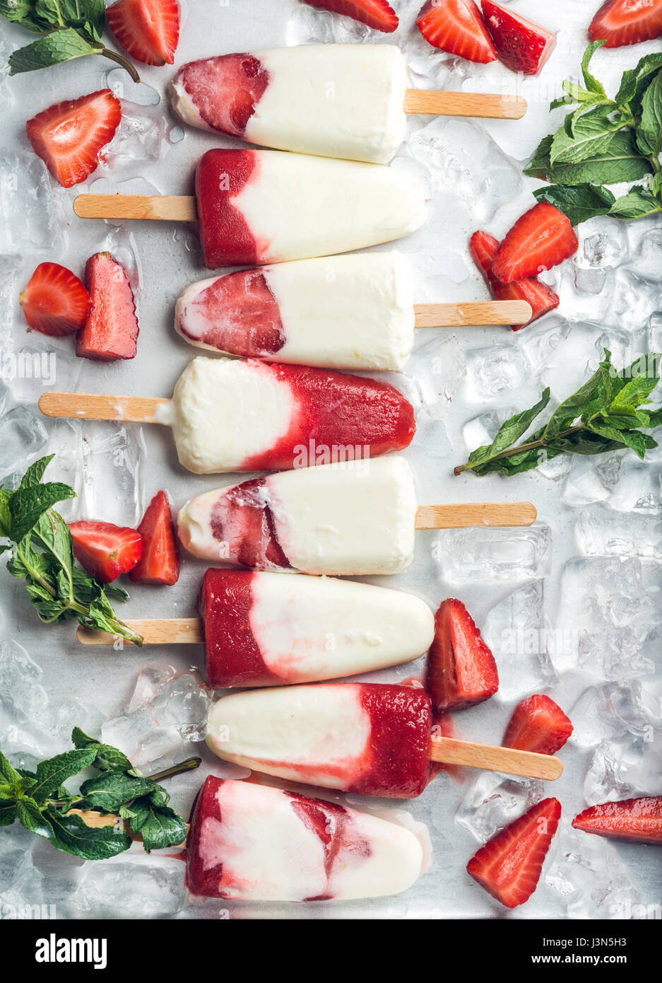 Strawberry yogurt ice cream popsicles with mint Stock Photo Alamy