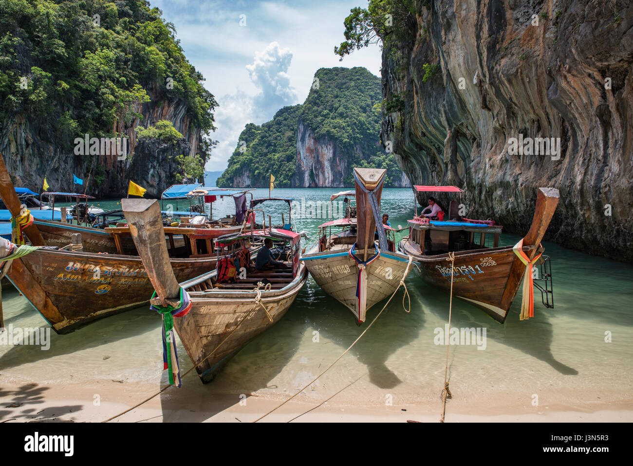 Boats parked in line on Paradise Island in Krabi Stock Photo
