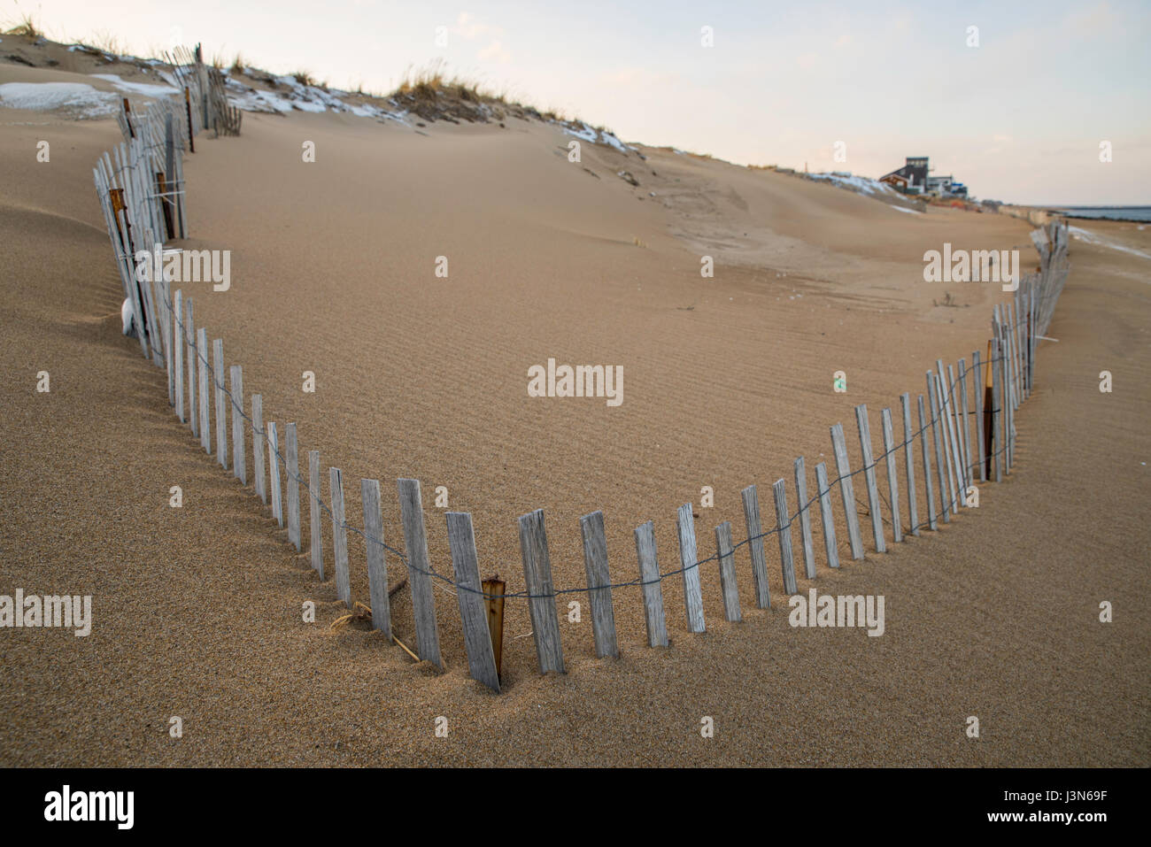 Buried fence on Plum Island, MA Stock Photo