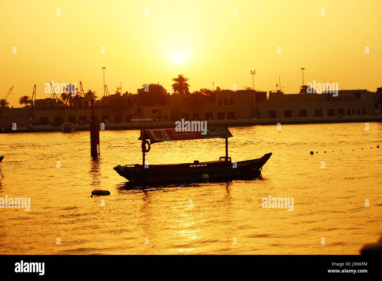 The Sunset with Boat Stock Photo