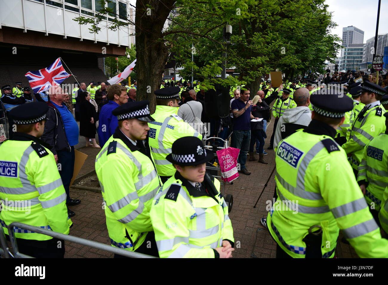 Police separate two groups of protesters demonstrating for and against