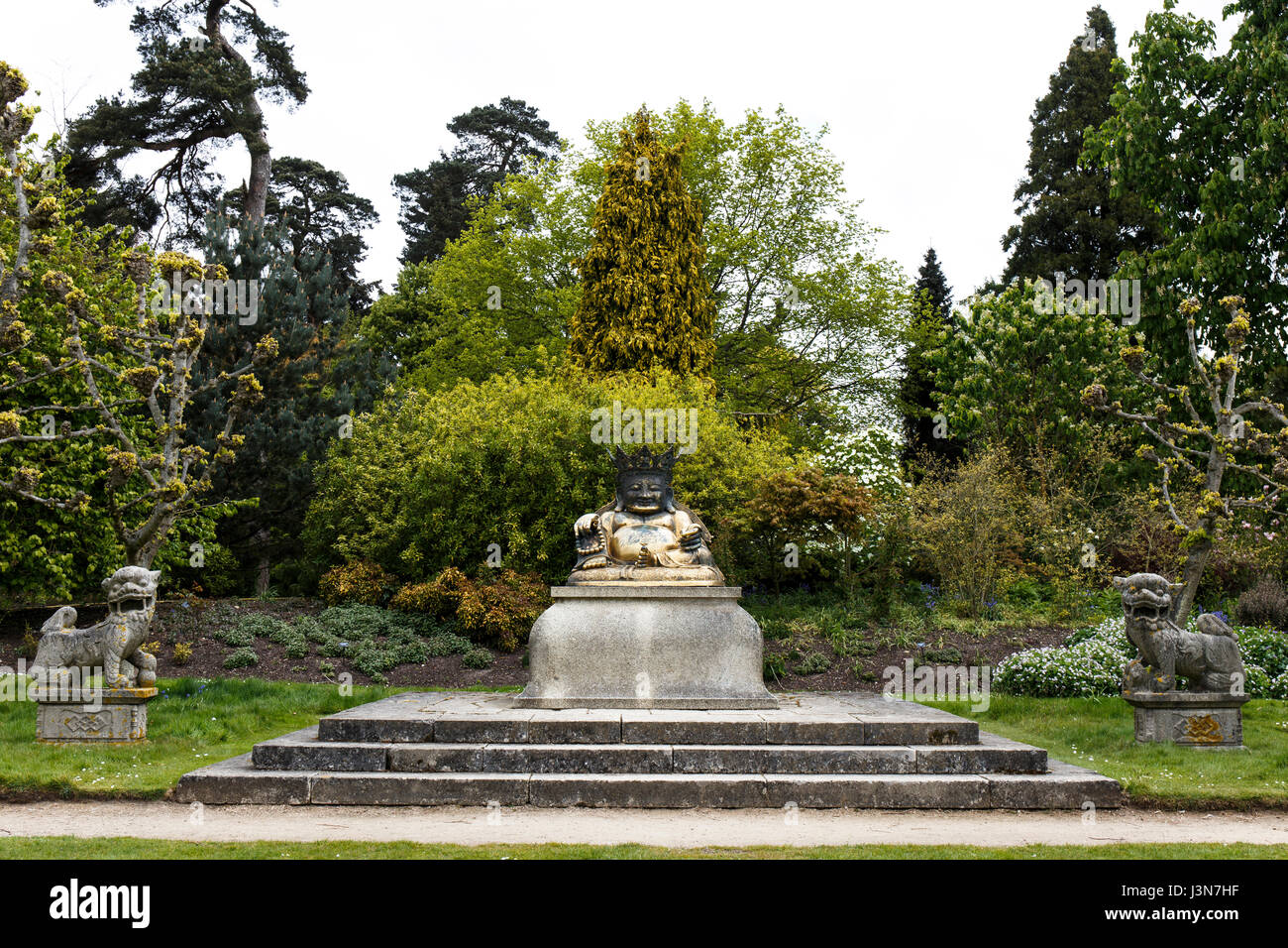 17th century Chinese statue of Buddha in the grounds of Sandringham House, Norfolk, England, UK. Stock Photo