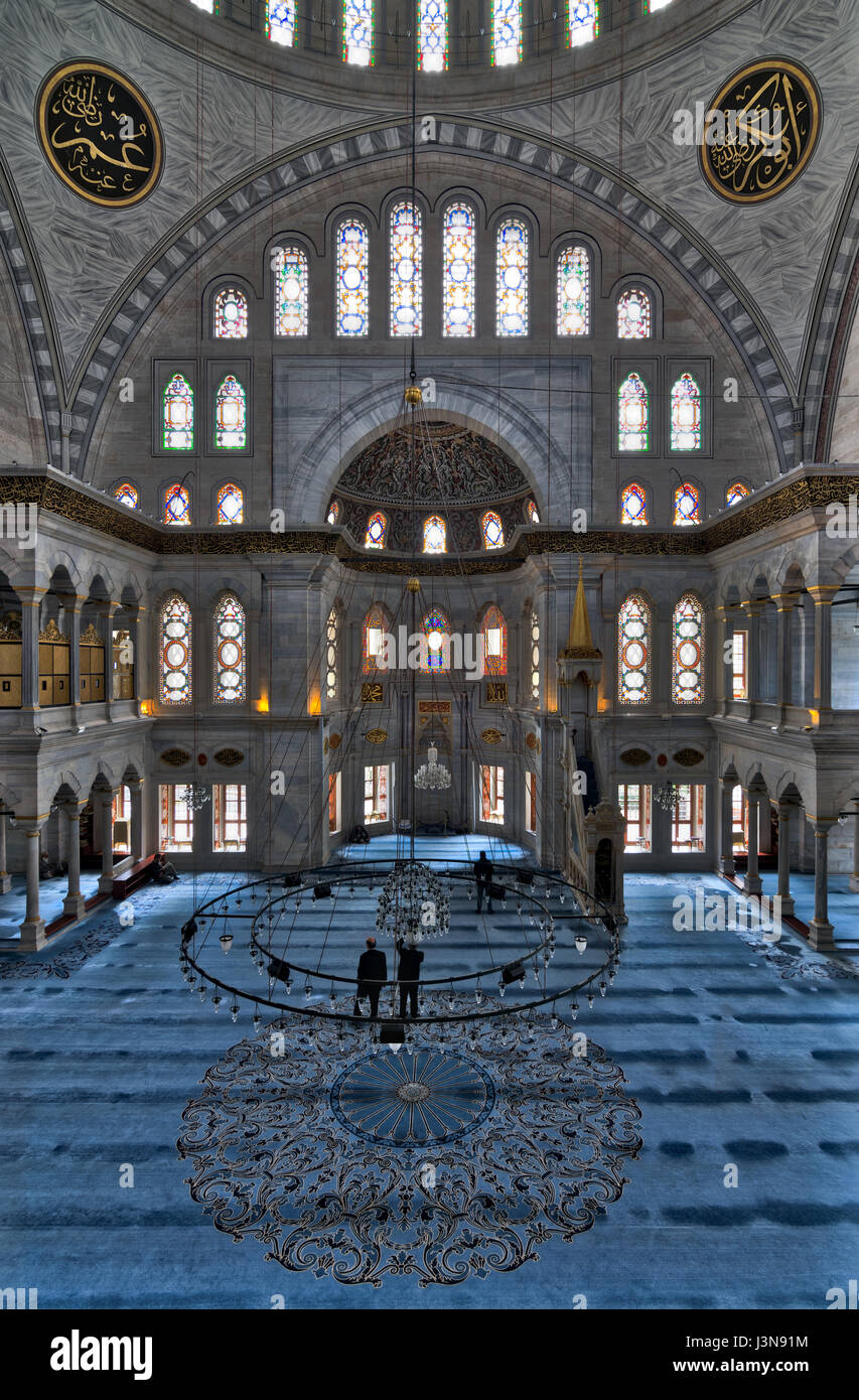 Interior of Nuruosmaniye Mosque, an Ottoman Baroque style mosque completed in 1755, with a huge dome & many colored stained glass windows located in S Stock Photo