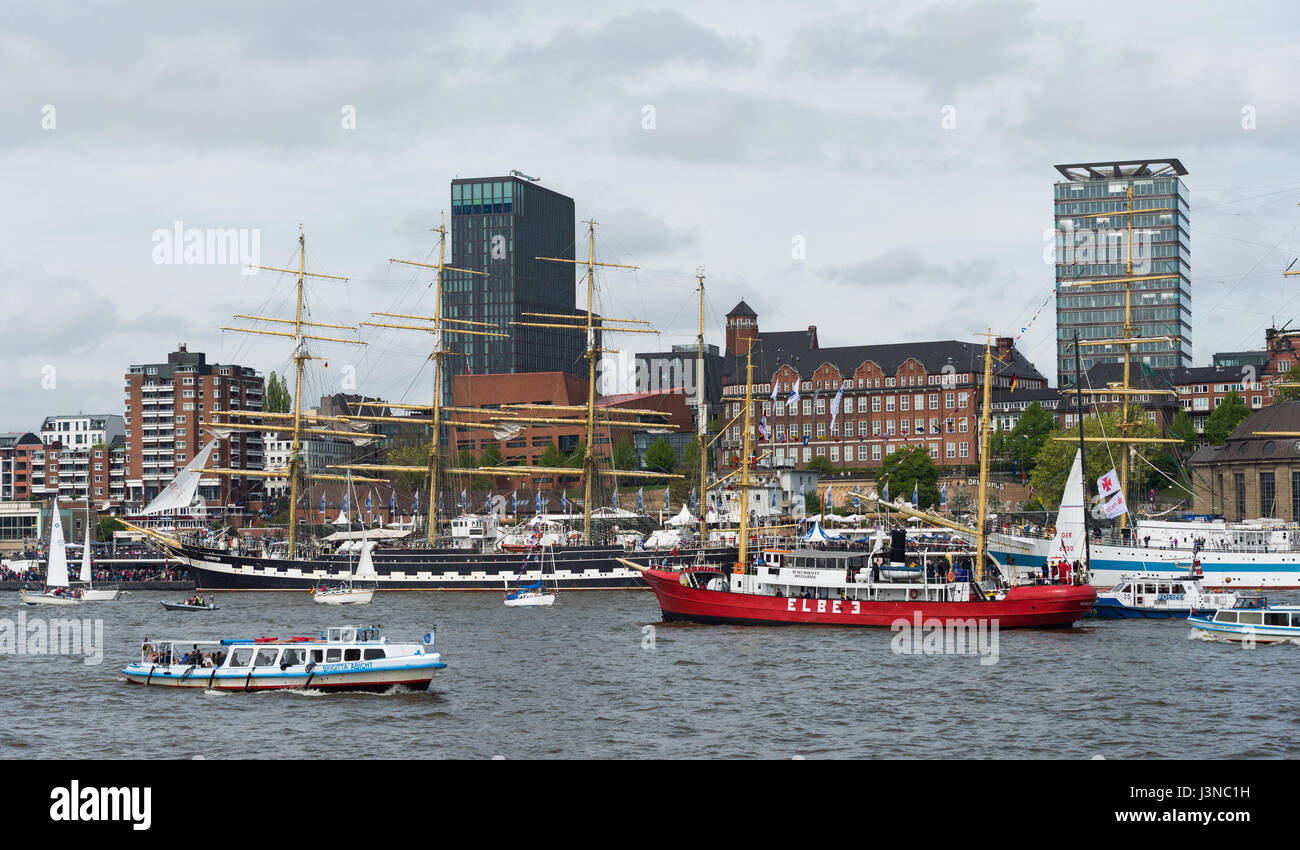 Hamburg, Germany. 06th May, 2017. The russian four-masted sailing ship 'Kruzenshtern' (back left) and the red museum ship 'Elbe 3' pictured on the Elbe in Hamburg, Germany, 06 May 2017. More than a million visitors and around 300 ships are expected to visit the harbour during the anniversary festivities between 05 and 07 May 2017. Photo: Christophe Gateau/dpa/Alamy Live News Stock Photo