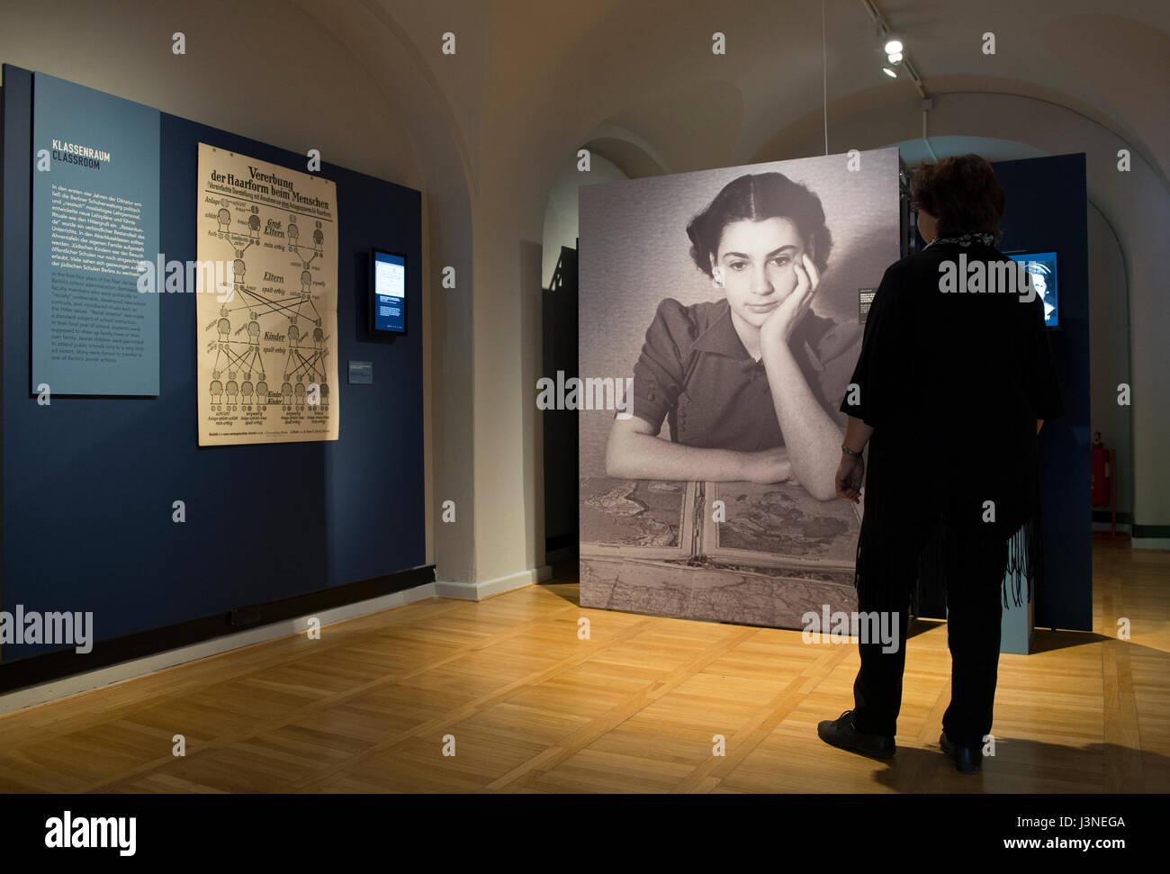 Berlin, Germany. 03rd May, 2017. A visitor stands in front of partition walls in the Maerkisches Museum (Marcher Museum) in Berlin, Germany, 03 May 2017. They are part of the exhibition 'Berlin 1937. In the shadow of tomorrow', which showcases items from that era, historical photographs, documents and film clips to illustrate life in the German capital of Berlin under the Nazi regime prior to World War II. Photo: Paul Zinken/dpa/Alamy Live News Stock Photo