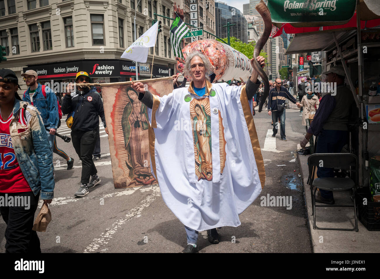 New York, USA. 06th May, 2017. The Rev. Alan Gordon, Canon of the Rhode Island based The Healing Church marches with advocates for the legalization of marijuana in New York on Saturday, May 6, 2017 at the annual NYC Cannabis Parade. The march included a wide range of demographics from millennials to old-time hippies. The participants in the parade are calling for the legalization of marijuana for medical treatment and for recreational uses. ( © Richard B. Levine) Credit: Richard Levine/Alamy Live News Stock Photo