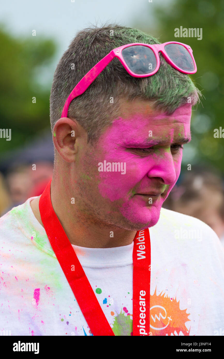 Man with pink powder paint on face hi-res stock photography and images -  Alamy