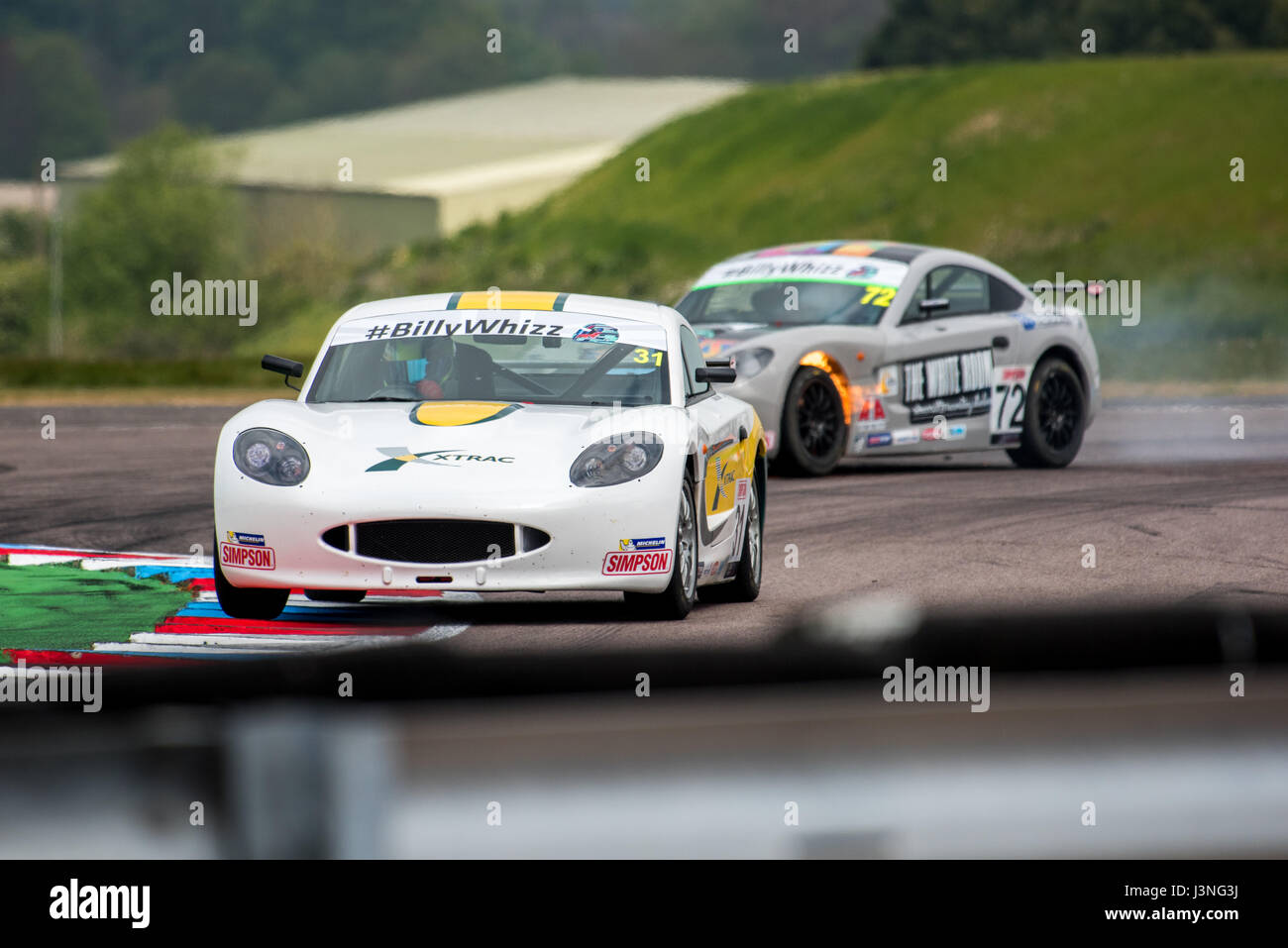 Hampshire, UK. 6th May, 2017. Thruxton Race Circuit and Motorsport Centre, Andover, Hampshire, United Kingdom. 6 May 2016. The brakes of rookie competitor Matt Luff (JHR Developments) lock up and catch fire as he exits the chicane. Simpson Race Products Ginetta Junior Championship - Qualifying at Dunlop MSA British Touring Car Championship. All cars race today with the #BillyWhizz number plates and livery in support of Billy Monger who suffered life changing injuries at Donington Park a few weeks ago during an F4 (Formula 4) British Championship Race. © Will Bailey / Alamy Live News Stock Photo