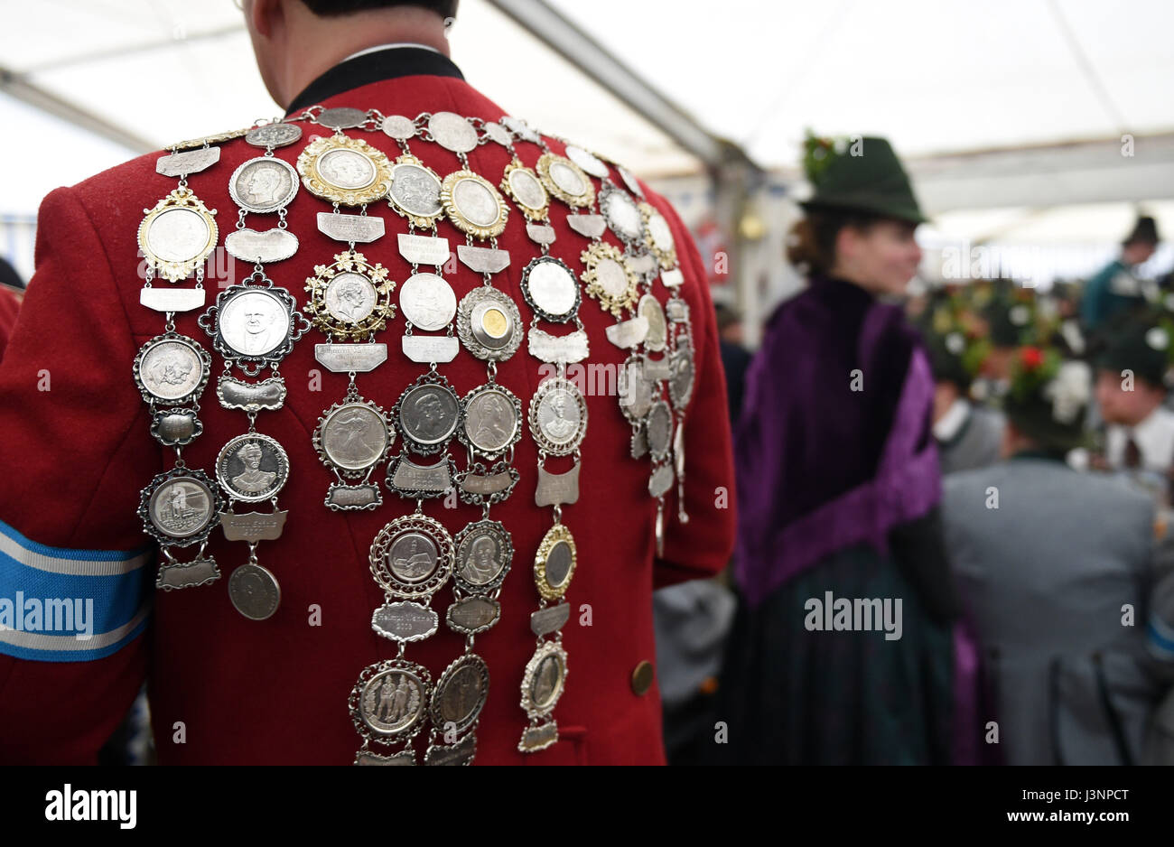 Gaissach, Germany. 7th May, 2017. A member of a traditional Bavarian Gebirgsschuetzen (lit. mountain marksmen) club wearing medals on his back during traditional Patronatstag feast day celebrations in Gaissach, Germany, 7 May 2017. The meeting takes place every May to honour the patron saint of the Gebirgsschuetzen, Mary the mother of Jesus. Photo: Andreas Gebert/dpa/Alamy Live News Stock Photo
