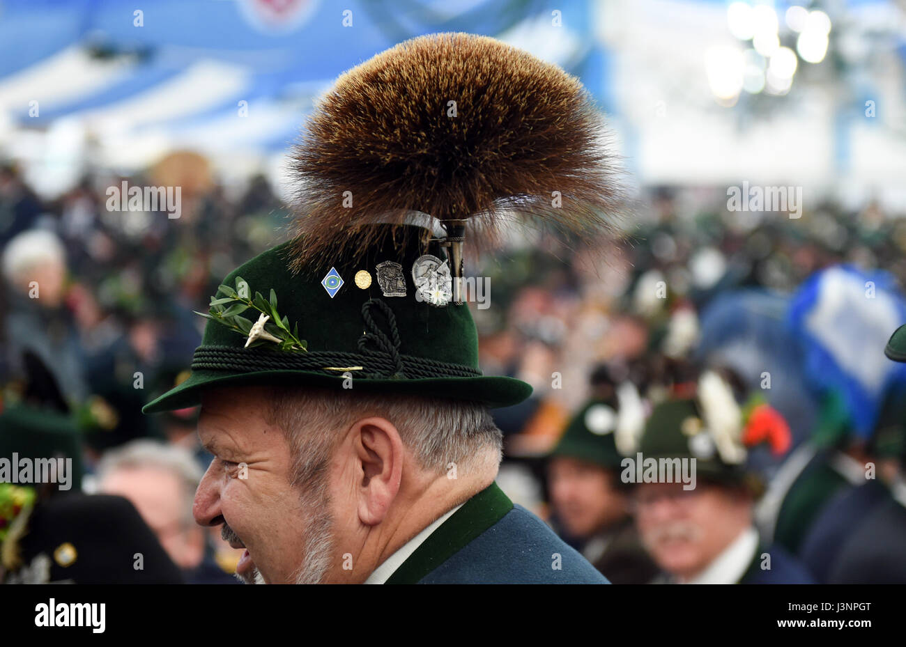 Gaissach, Germany. 7th May, 2017. A member of a traditional Bavarian Gebirgsschuetzen (lit. mountain marksmen) club wearing a Gamsbart hat in a beer tent during traditional Patronatstag feast day celebrations in Gaissach, Germany, 7 May 2017. The meeting takes place every May to honour the patron saint of the Gebirgsschuetzen, Mary the mother of Jesus. Photo: Andreas Gebert/dpa/Alamy Live News Stock Photo