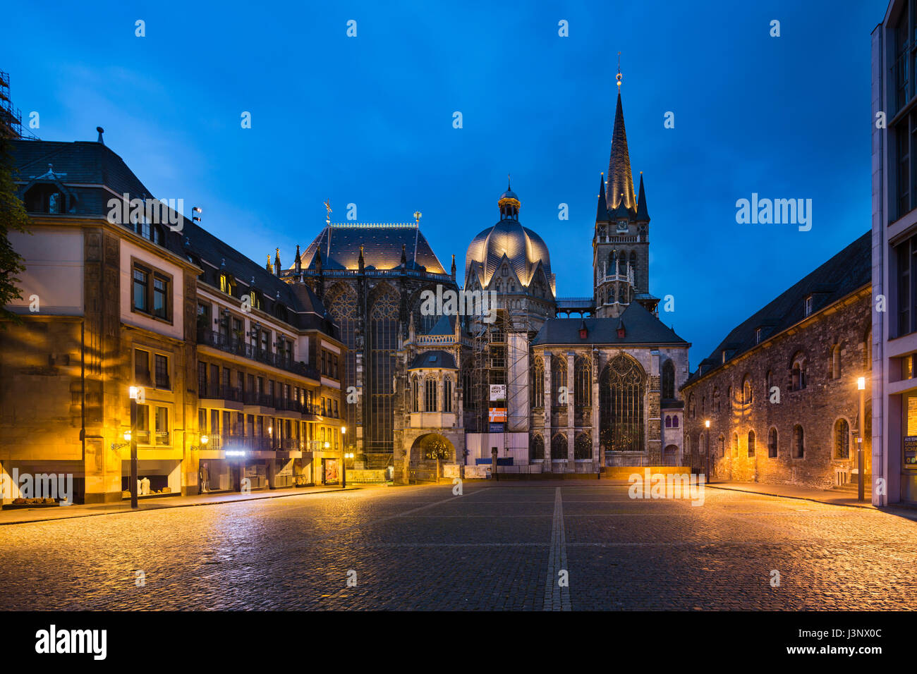 AACHEN - JULY 26: The famous cathedral of Aachen, Germany with night blue sky seen from the Katschhof on July 26, 2016. Stock Photo