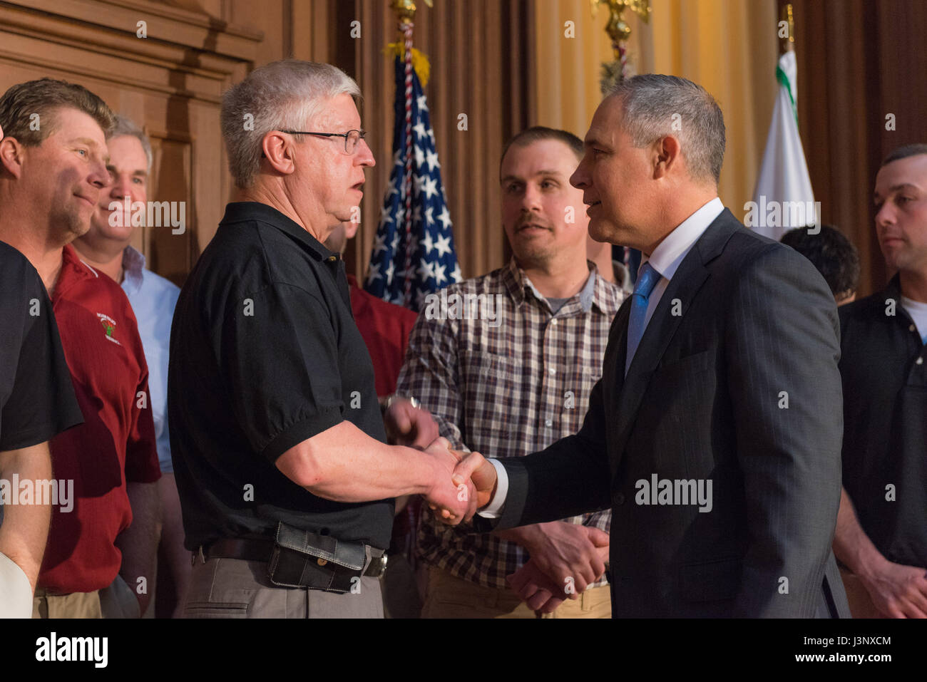 U.S. EPA Administrator Scott Pruitt greets coal industry executives following a signing ceremony for a series of anti-environmental executive orders aimed at repealing restrictions on coal at the Environmental Protection Agency headquarters March 28, 2017 in Washington, DC. The orders roll back at least 10 major Obama environmental regulations and fulfills a wish list from the fossil fuel industry. Stock Photo