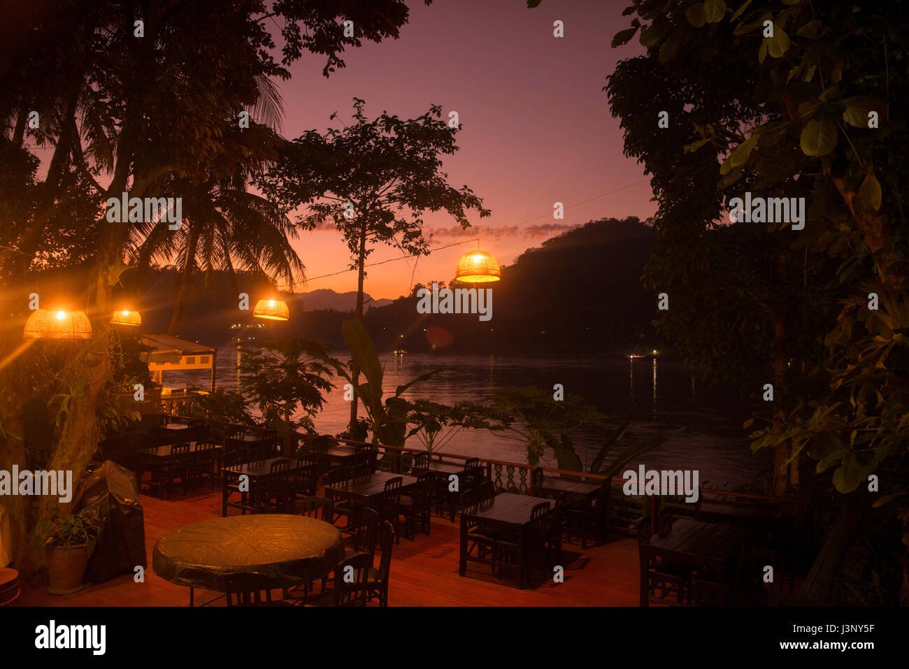 a restaurant at the Mekong River in the town of Luang Prabang in the north of Laos in Southeastasia. Stock Photo