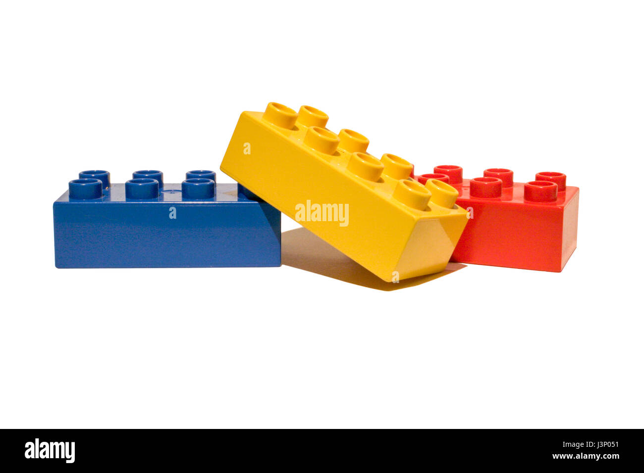 Children's coloured plastic toy building blocks isolated on a white ...