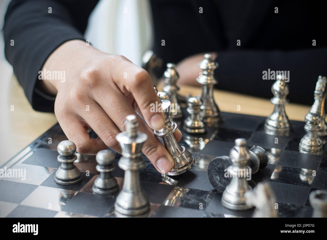 Handsome Male Model Considers His Next Chess Move Stock Photo