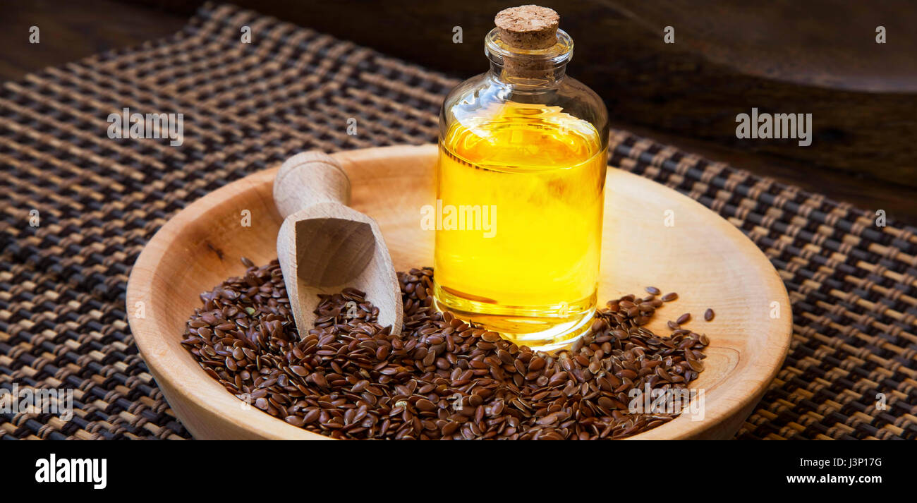 Flax seed oil bottle, healthy fats omega3 seed oil with flax seeds in