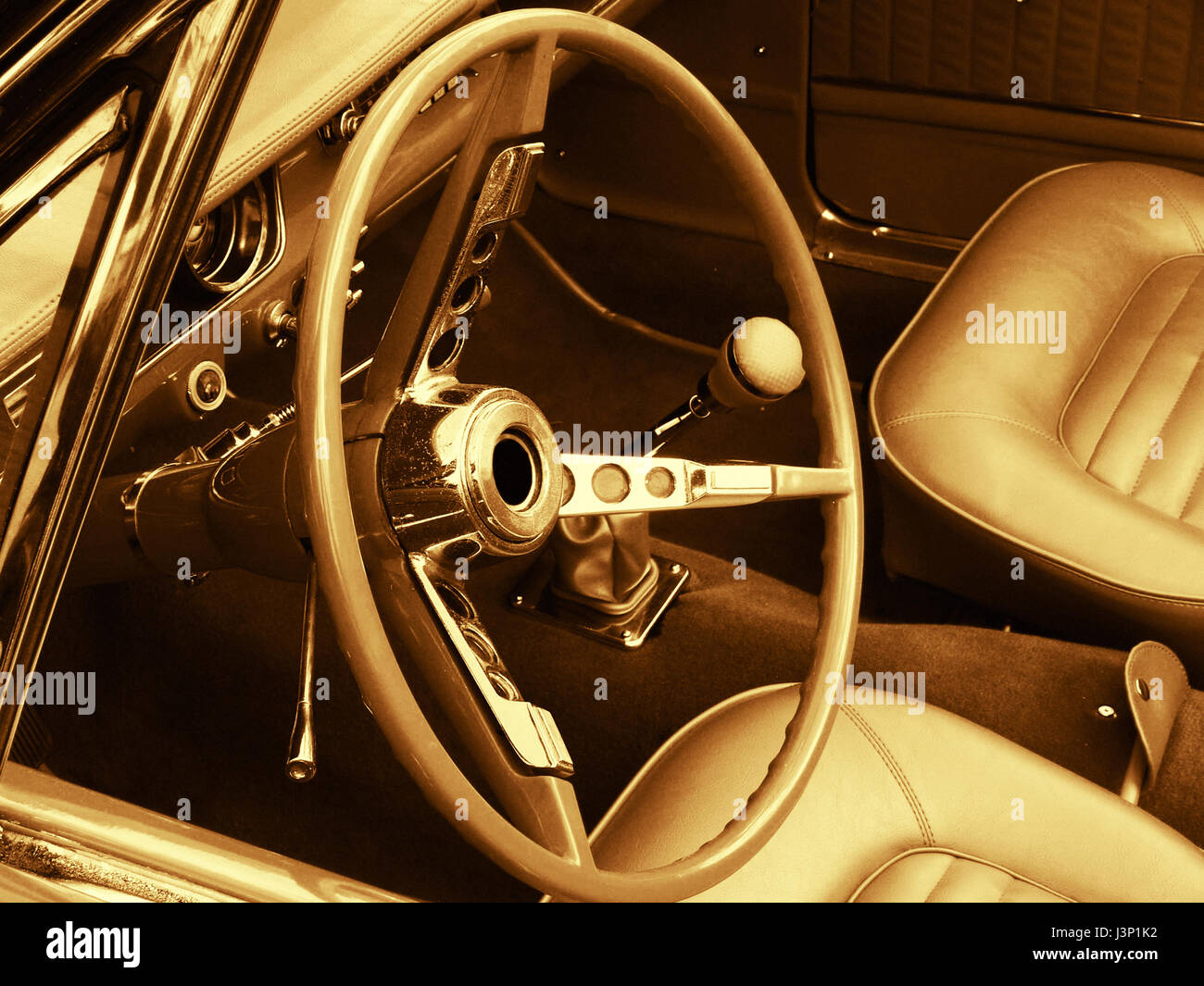 interior of a classic ford car seats, steering wheel and dashboard