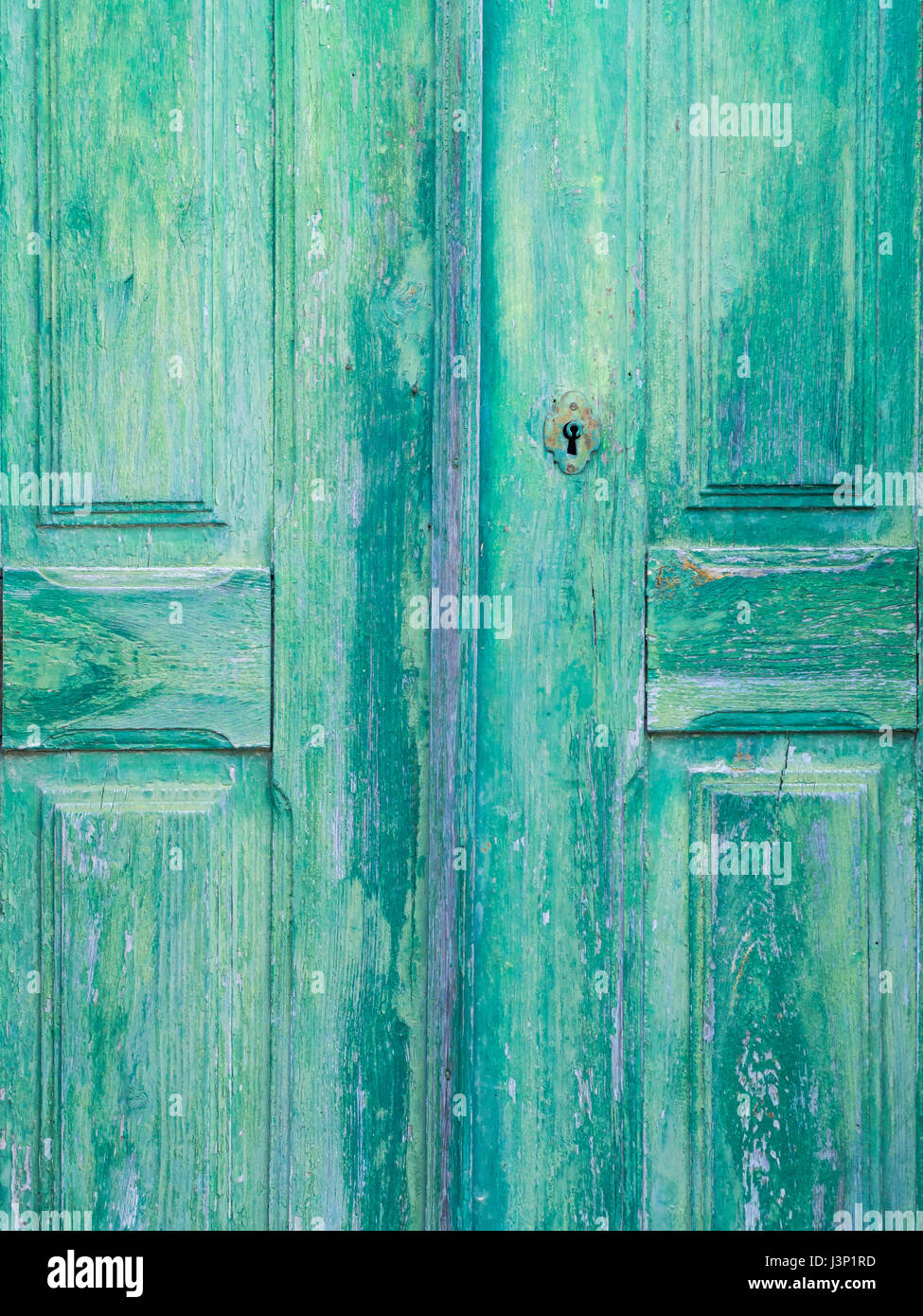 Old green wooden door in Obidos, Portugal Stock Photo