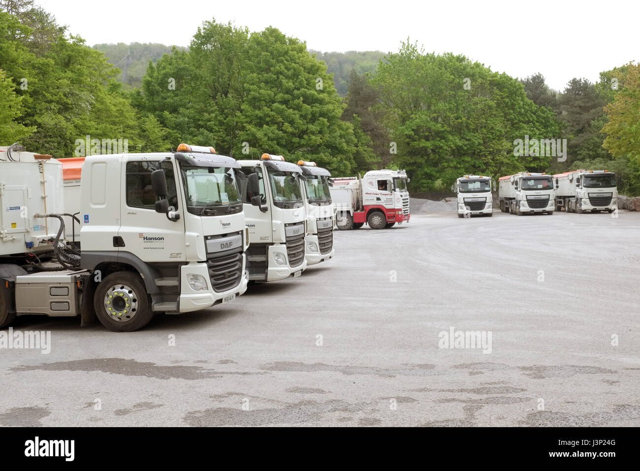 6th May 2017 - Lot of parked heavy trucks from Hansen Aggregates in Cheddar, Somerset, England, Stock Photo