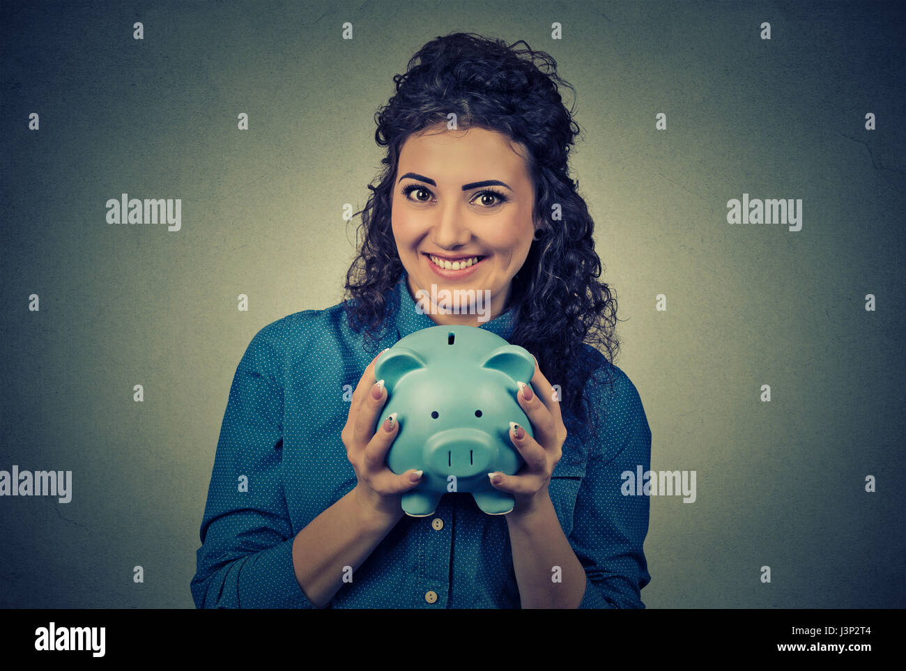 Young woman with piggy bank Stock Photo - Alamy